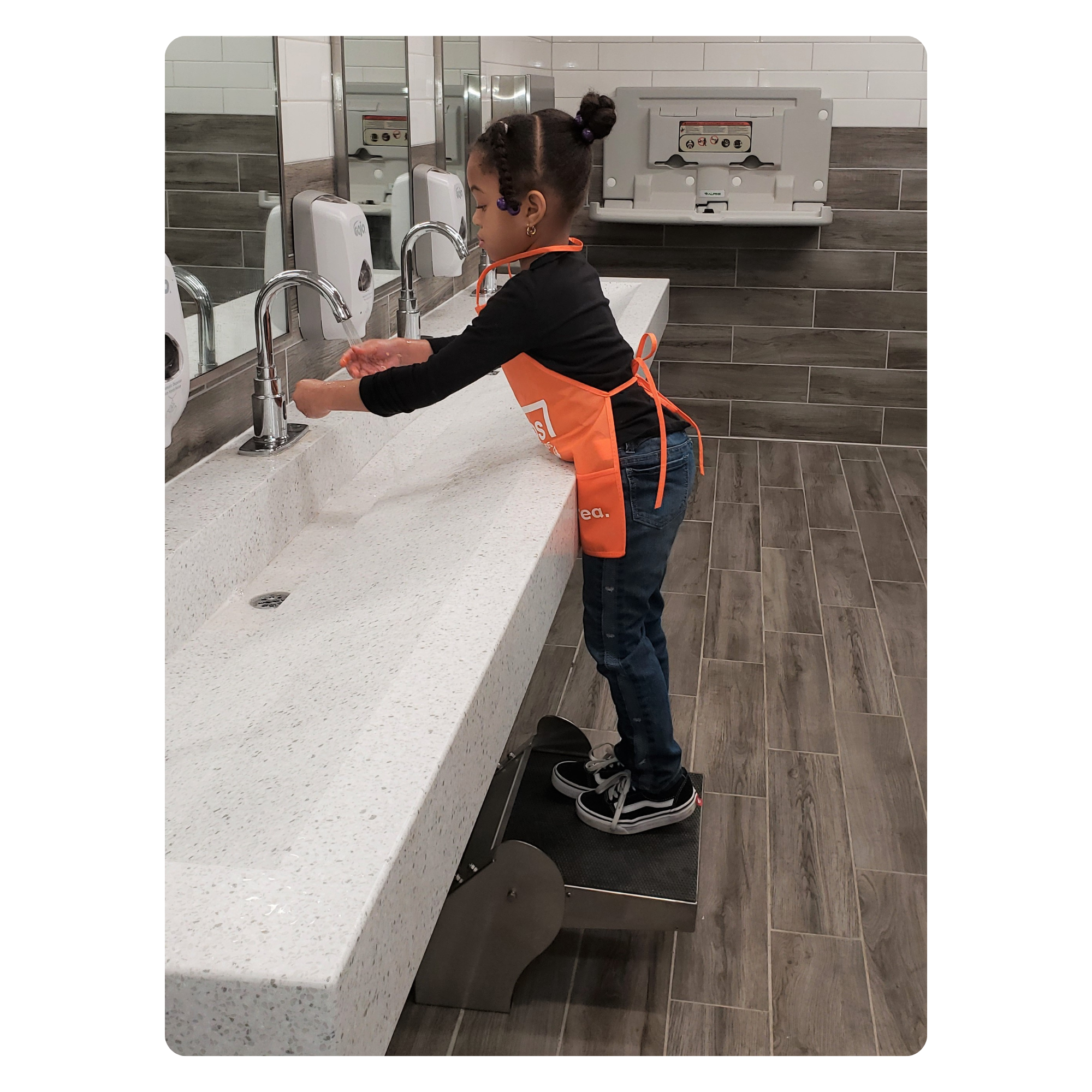 Step 'n Wash step stool in a Home Depot restroom